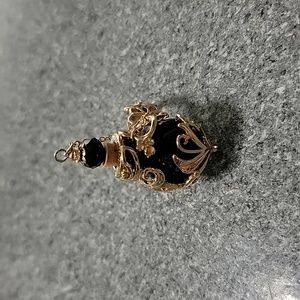 New without tags, Adjustable size Poison bottle ring Goldtone and black glass